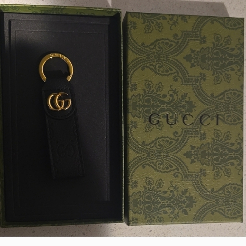 Gucci Black and Gold Logo Keyring